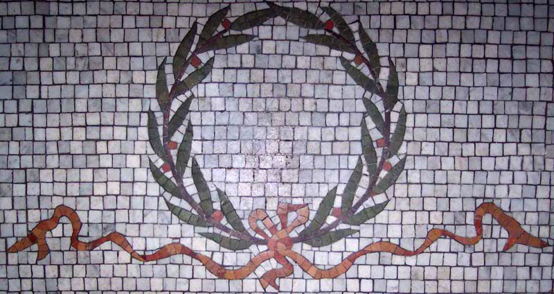 Stone wreath mosaic in entryway